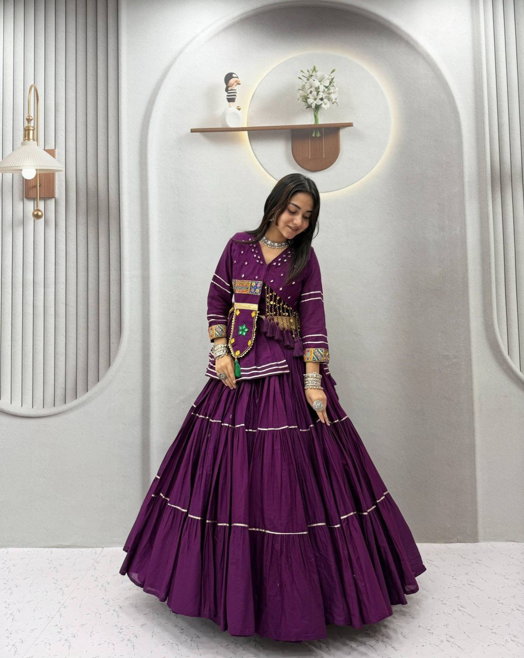 Tiered Flared Lehenga with Tasseled Embroidered Koti Jacket