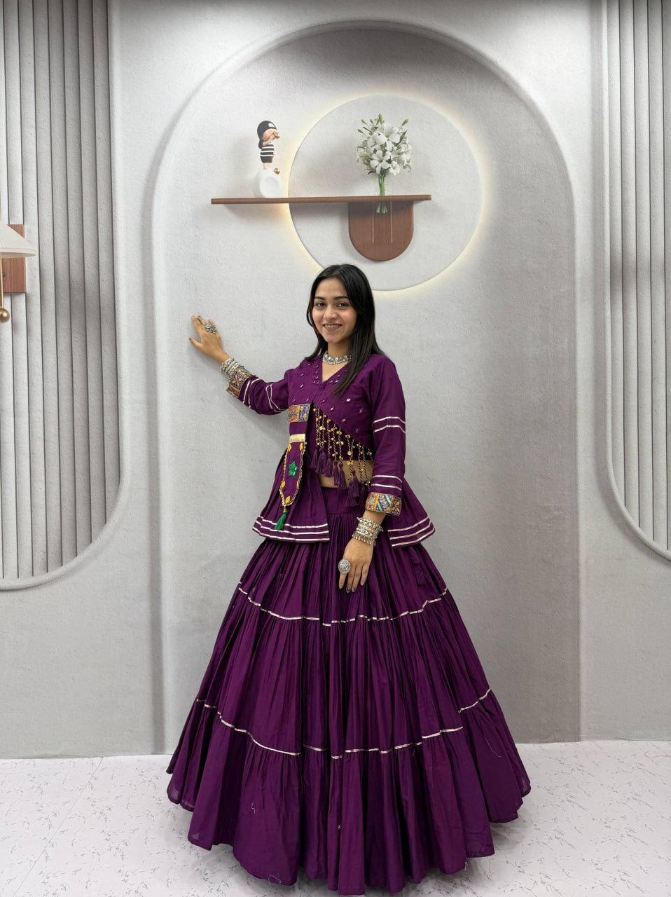 Tiered Flared Lehenga with Tasseled Embroidered Koti Jacket